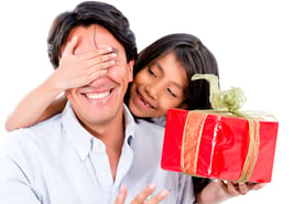 Happy girl giving her father a surprise present - isolated over white
